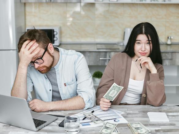 a man and woman doing budgeting