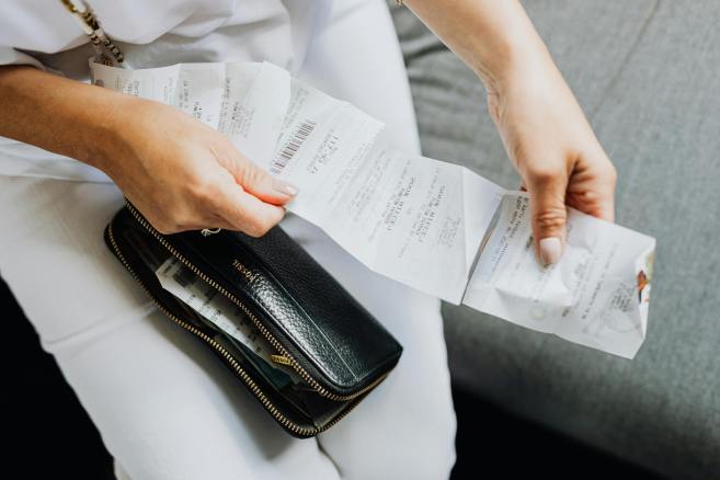 a person holding a wallet